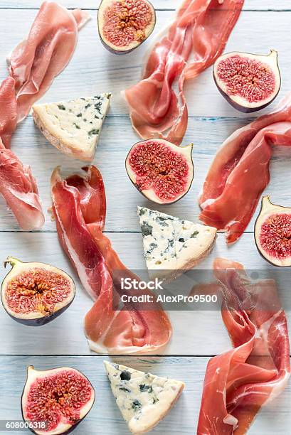 Slices Of Jamon With Blue Cheese And Figs Stock Photo - Download Image Now - Appetizer, Arugula, Bacon