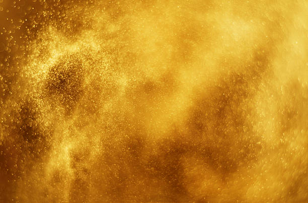 istock Glitter golden light with smoke and bokeh 608009594