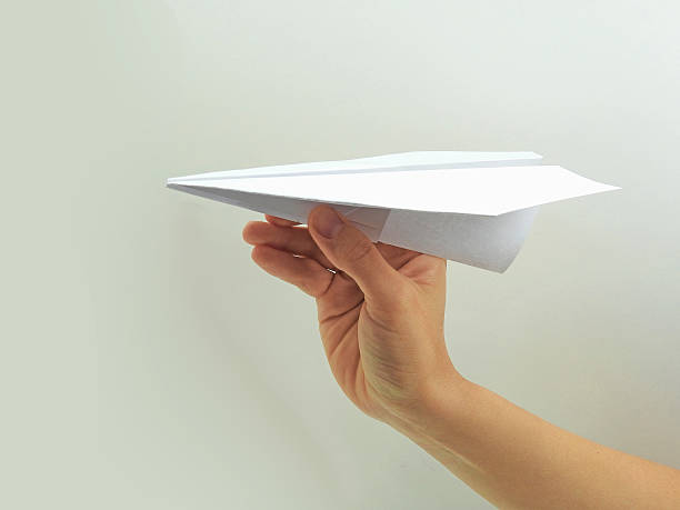 istock Paper plane in woman hand 608009648