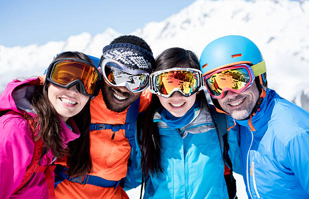 istock Happy group of friends skiing 608010110