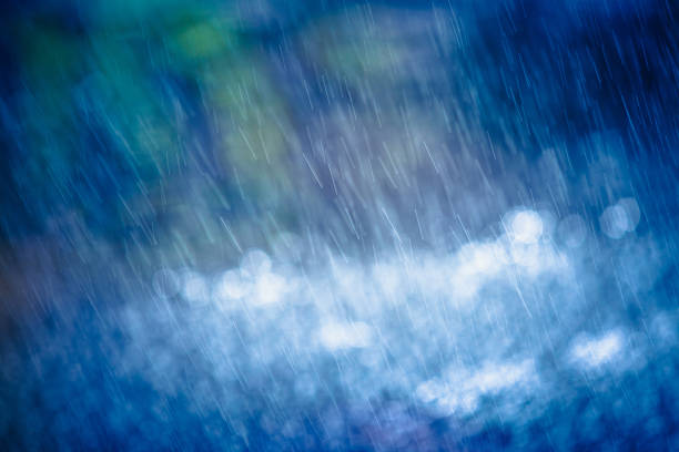istock Nature Background - Rain And Bokeh Abstract Blue Green White 608010974