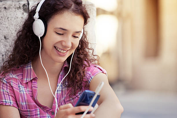 istock Woman is listening music. 608481956