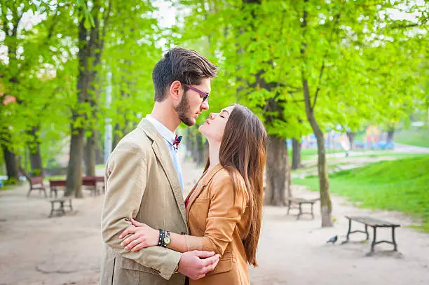 Photo of Young fashion hipster couple in love kissing and having passion