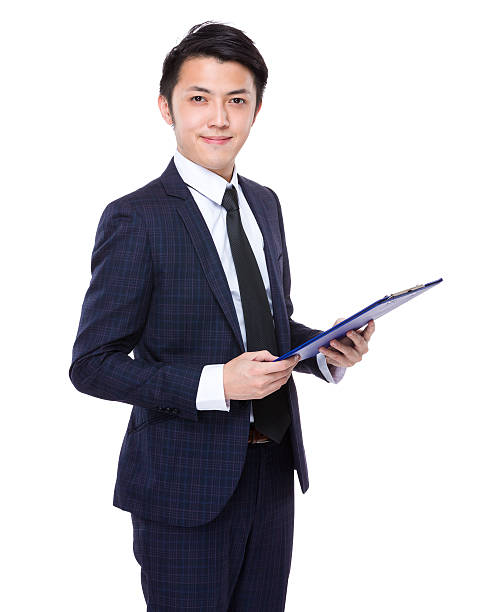 istock Businessman holding a clipboard 608482676