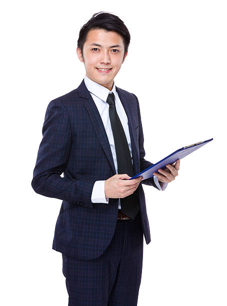 istock Businessman holding a clipboard 608482958