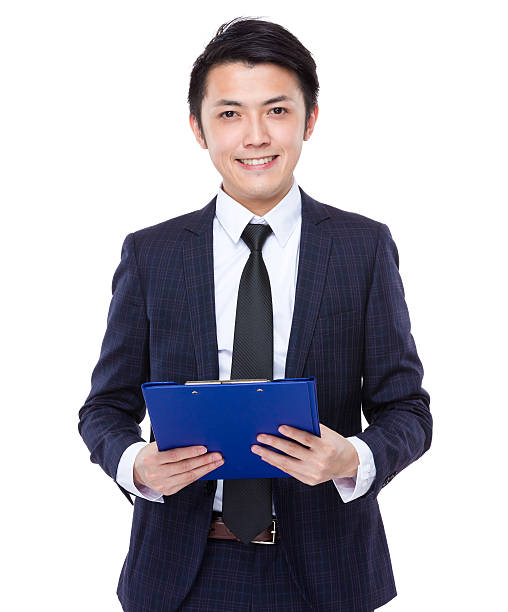 istock Businessman holding a clipboard 608488034