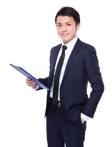istock Businessman holding a clipboard 608489228