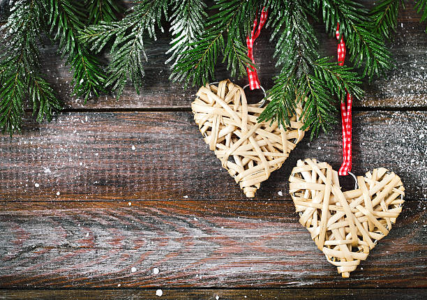 istock Christmas fir tree with X-mas decorations on wooden back 608490662