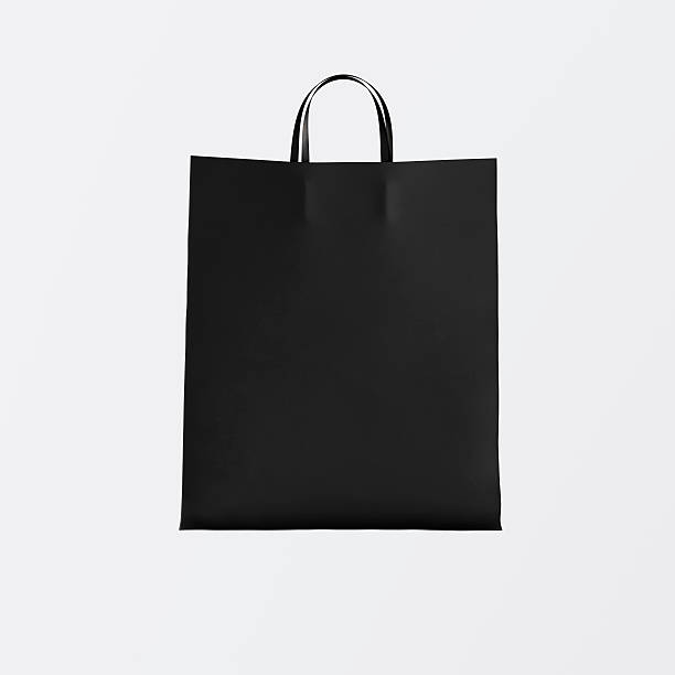 istock Closeup Black Paper Bag Isolated Center White Empty Background.Mockup 608508636