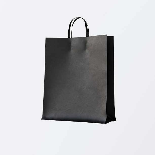 istock Closeup Black Paper Bag Isolated Center White Empty Background.Mockup 608508720