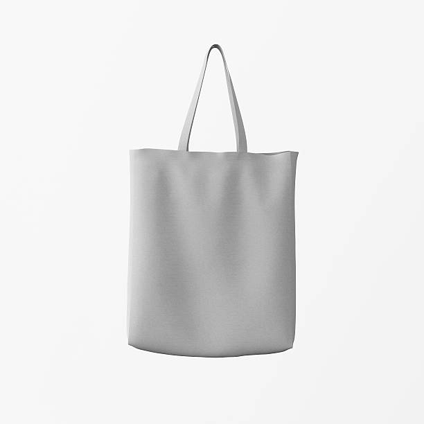 istock Closeup Gray Cotton Textile Bag Hanging Center White Empty Background 608509560