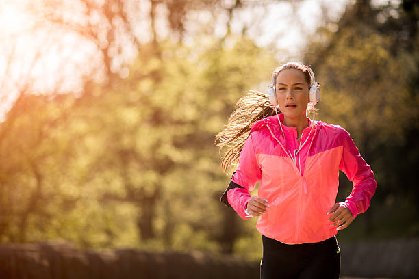 istock Sportswoman during jogging in the morning 608510652