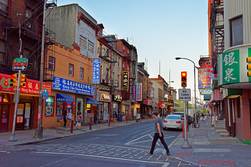Philadelphia, United States - May 5, 2015: Street view in Chinatown in Philadelphia of Pennsylvania, the USA. Tourist crossing in the street