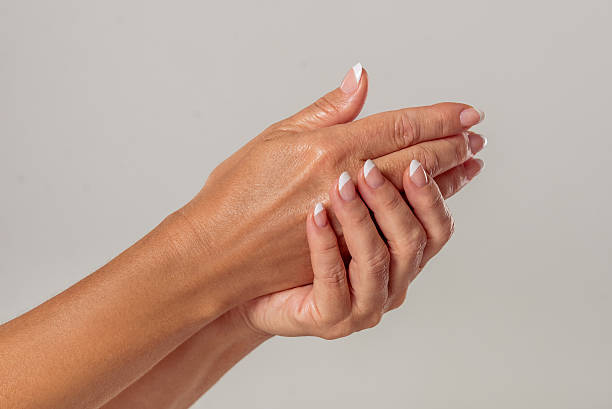 istock Hands of middle aged woman 608515160