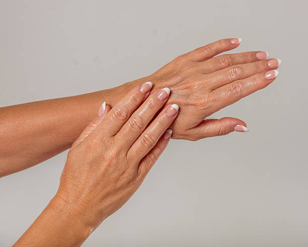istock Hands of middle aged woman 608515290