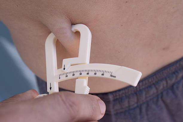 istock Man measuring body contouring 608515990