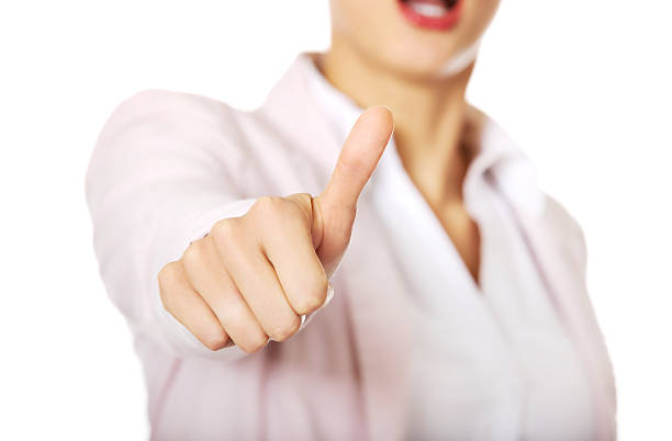 istock Young happy business woman with thumb up 608517032