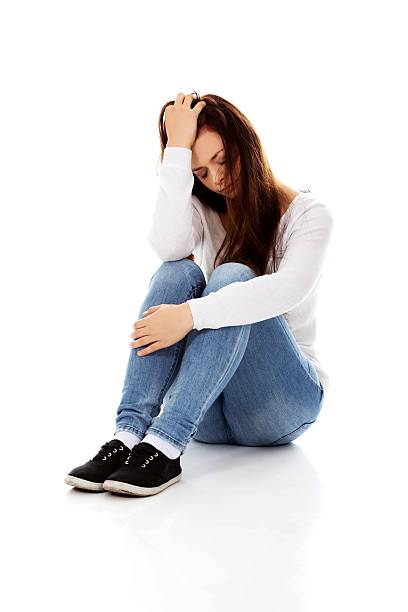 istock Young depression woman sitting on the floor 608518800