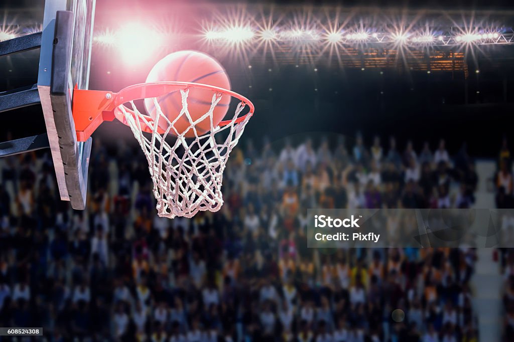 basketball scoring during match in arena Basketball - Ball Stock Photo