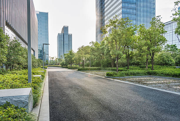 istock city empty traffic road with cityscape in background 608527408