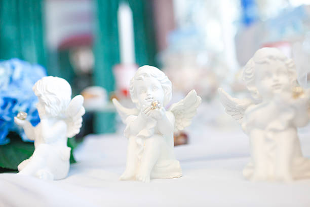 istock Three statues of angels on the table 608527496