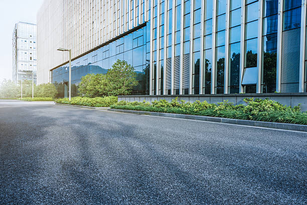 istock city empty traffic road with cityscape in background 608527518