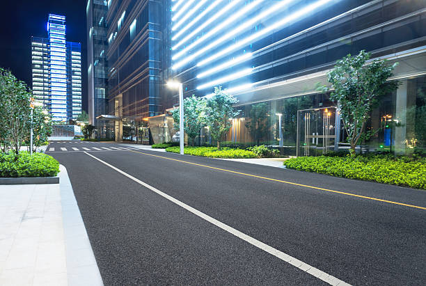 istock city empty traffic road with cityscape in background 608530204