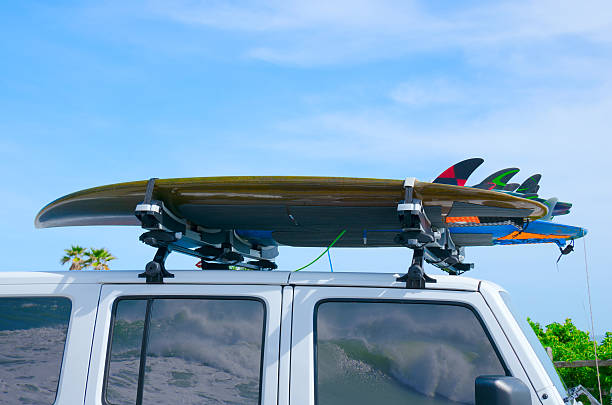istock Surfboards on truck w wave reflections in windows 608538534