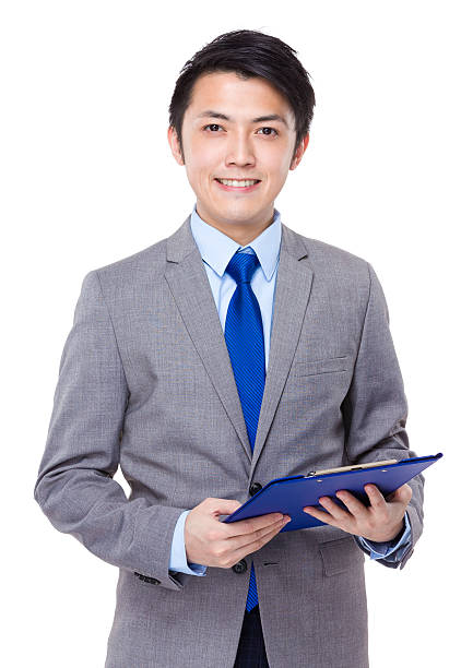 istock Businessman holding a clipboard 608539168