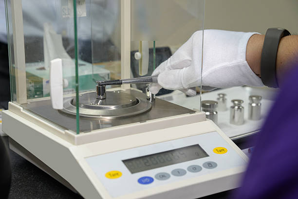 istock weight measure on the electronic balance 608542366