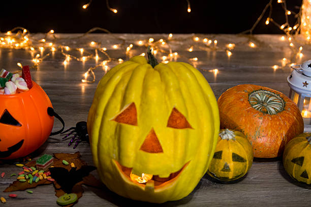 istock Halloween pumpkin head jack lantern on wooden background 608543032