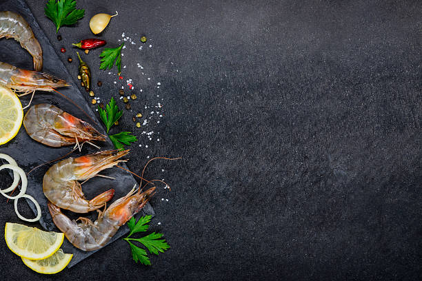 istock White Seafood Shrimps with Spices on Copy Space 608547560
