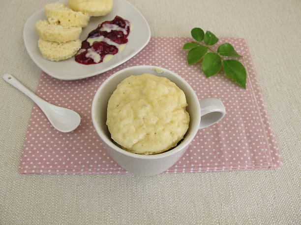 istock Homemade mug dumplings with red fruit groats and vanilla sauce 608549612