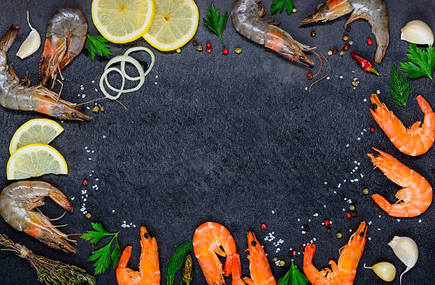 istock Copy Space Frame with Seafood Shrimps and Ingredients 608552910