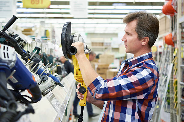 istock Man shopping for angle grinder in hardware store 608563094