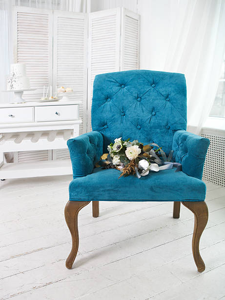 istock Wedding bouquet with ranunculus on the blue armchair 608573190