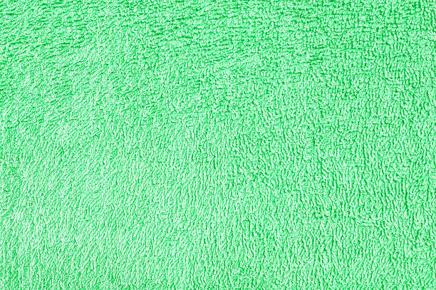 istock Closeup surface fabric pattern at old green fabric towel texture background 608575924