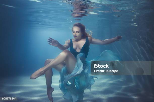 Woman Dives Underwater Stock Photo - Download Image Now - Underwater, Women, Teenage Girls