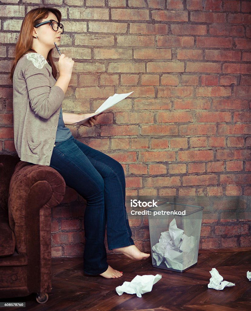 Young woman writer working Young woman writer working in the loft Adult Stock Photo