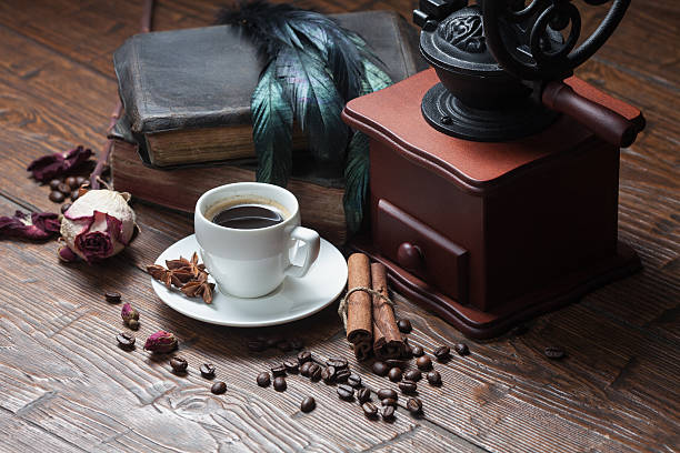 istock Cup of coffee, dry rose and grinder 608582496