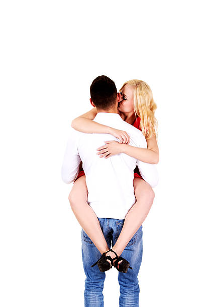 istock Back view of man carrying his girlfriend 608590736
