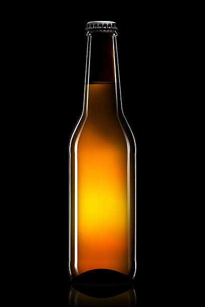 istock Bottle of beer or cider isolated on black background 608592806