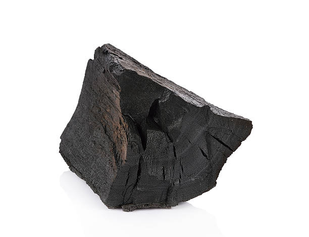 istock wood charcoal isolated on white background. 608596954