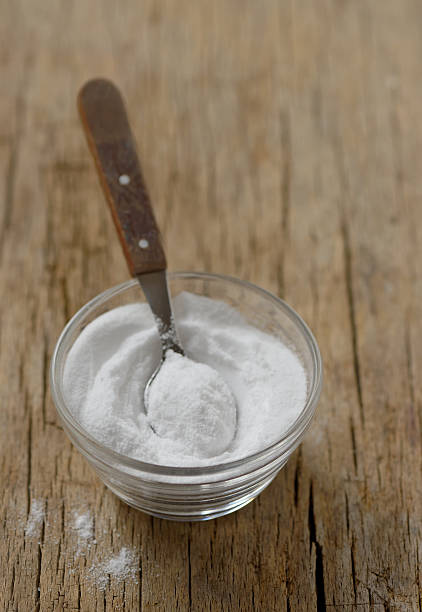 istock Spoon of baking soda in bowl 608596966