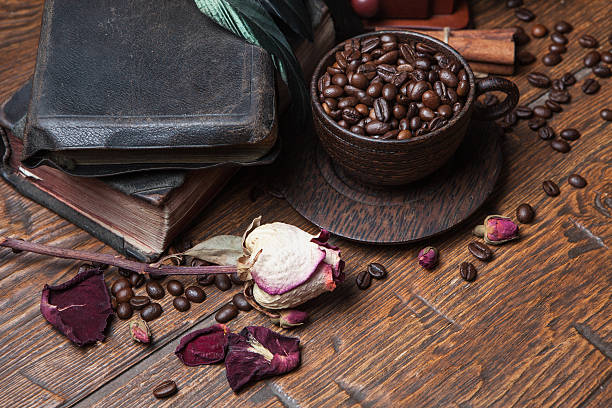 istock Cup of coffee, dry rose and grinder 608599690