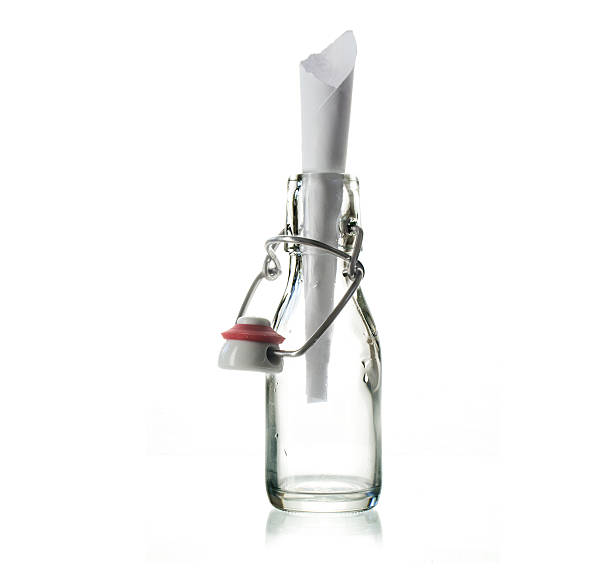 istock glass bottle with a message isolated on a white background 608600700
