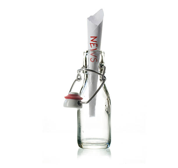 istock glass bottle with NEWS message isolated on a white background 608600858