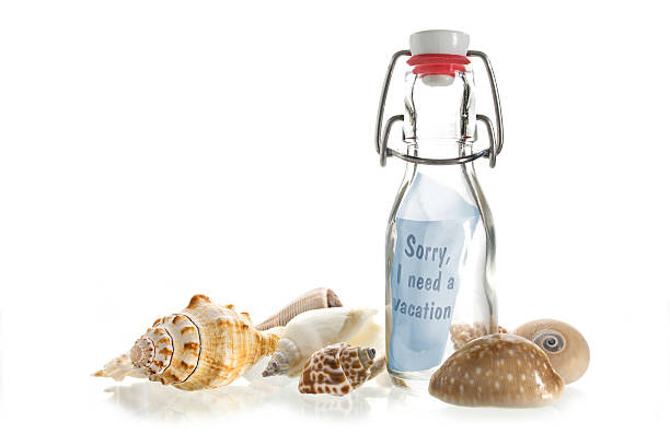 istock Sorry, I need a vacation, message in a bottle, isolated 608601370