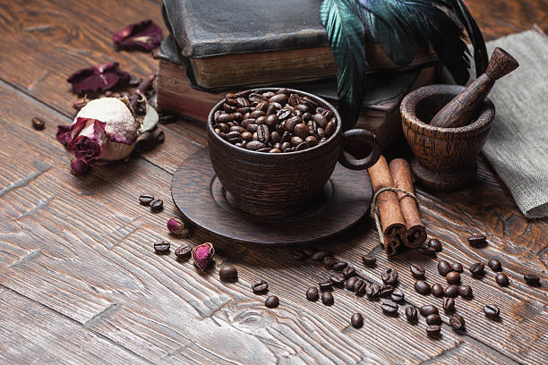 istock Cup of coffee, dry rose and grinder 608601946