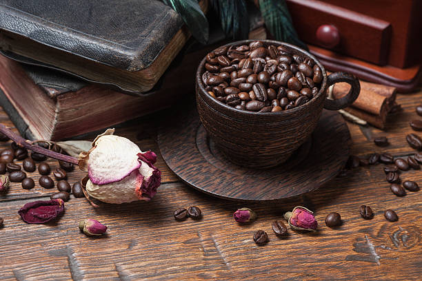 istock Cup of coffee, dry rose and grinder 608602466